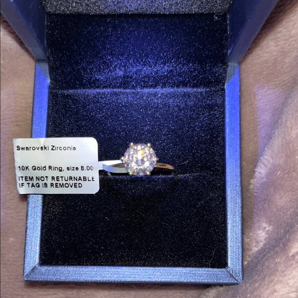 LUX-ORO, 10K Gold, 
Swarovski Zirconia Solitaire ring.